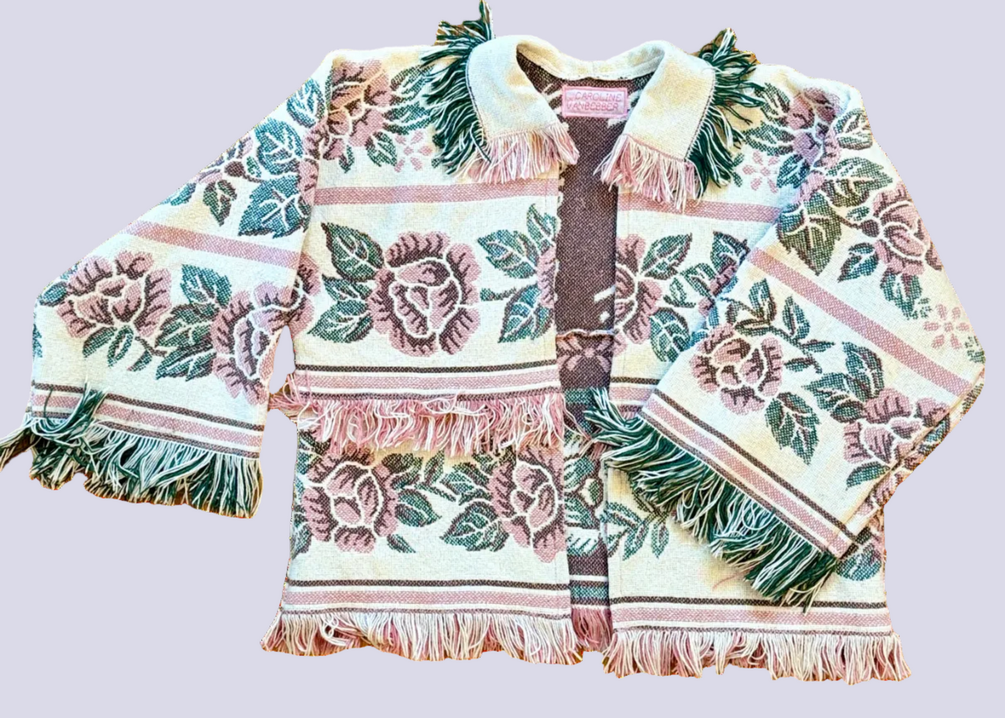 Floral patterned jacket with fringes on a white background